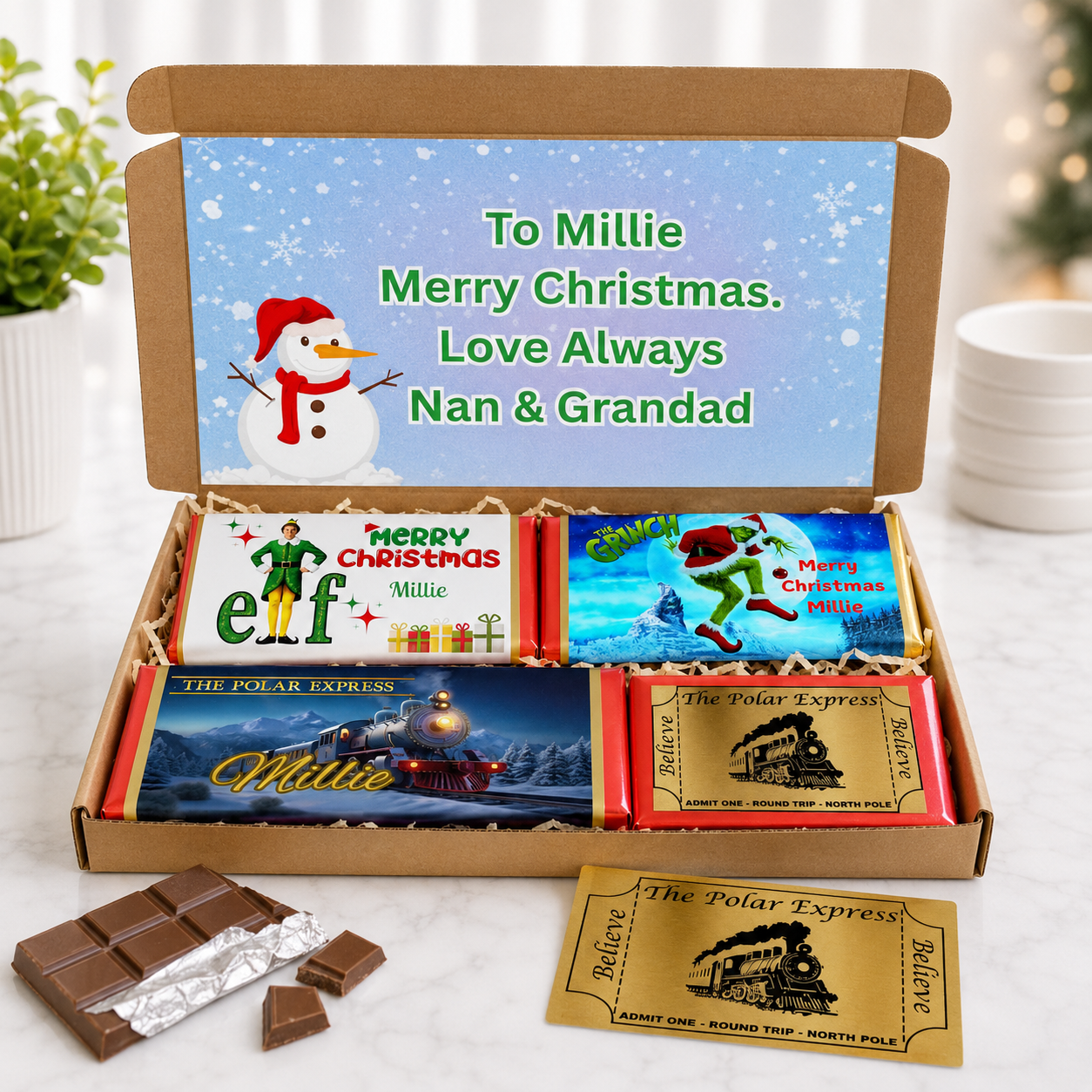 Personalised Christmas chocolate bar hamper with Polar Express golden ticket, Elf, Grinch and festive chocolate bar wrappers.